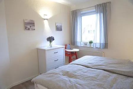 Schlafzimmer mit Doppelbett Zur Hanse Wohnung 1.4