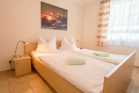 Schalfzimmer mit Doppelbett Residenz am Strand Wohnung 4-60