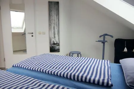 Schlafzimmer mit Doppelbett Parkresidenz am Hafen Wohnung HF 26 - "Min Höög"