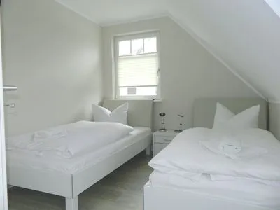 Schlafzimmer mit zwei Einzelbetten  Haus Frieda