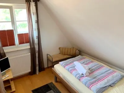 Schlafzimmer mit Einzelbett  Haus Leni
