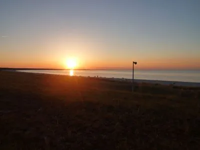 Sonnenuntergang Hafenstrasse 15 in Prerow Wolkenglanz in Prerow