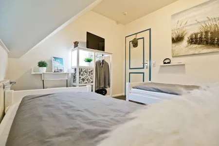 Schlafzimmer mit zwei Einzelbetten Ferienpark Freesenbruch Doppelhaushälfte 11a - Schwalbennest