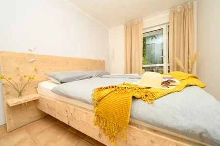 Schlafzimmer mit Doppelbett Residenz am Strand Deichpoofe -  Wohnung 1-06