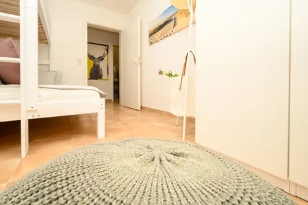 Schlafzimmer mit Hochbett Residenz am Strand Deichpoofe -  Wohnung 1-06