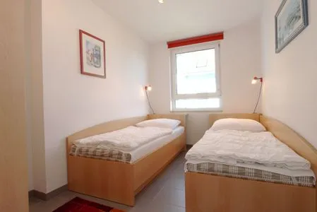 Schlafzimmer mit zwei Einzelbetten Residenz am Strand Wohnung 4-59