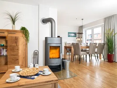 Wohnzimmer mit Kamin Haus Südwester Ringelrobbe