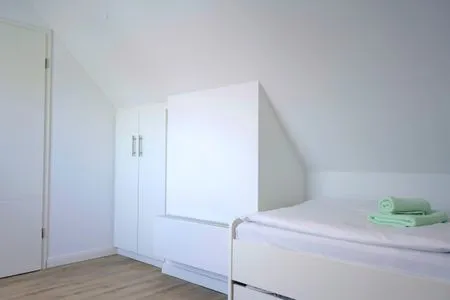 Schlafzimmer mit zwei Einzelbetten  Strandperle - Anlage Heiderose