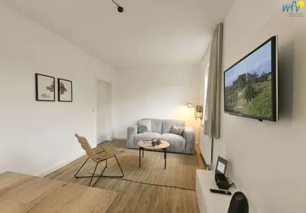 Wohnzimmer Haus am Dorfbrunnen Ferienwohnung Muschel