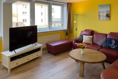 Wohnzimmer der Ferienwohnung "Willkommen bei den Hartmanns" in Wittdün auf Amrum Haus Nordenlicht Ferienwohnung „Willkommen bei den Hartmanns"