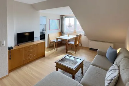 Wohnzimmer in der Ferienwohnung Gaubenkieker des Hauses Südspitze 17 in Wittdün auf Amrum Haus *Südspitze 17* Ferienwohnung *Gaubenkieker*