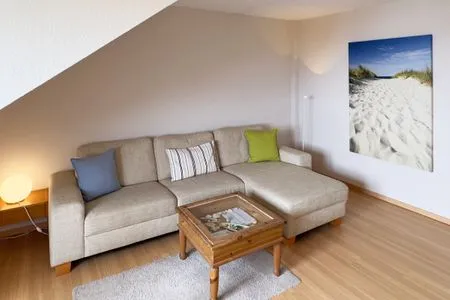 Wohnzimmer in der Ferienwohnung Gaubenkieker des Hauses Südspitze 17 in Wittdün auf Amrum Haus *Südspitze 17* Ferienwohnung *Gaubenkieker*