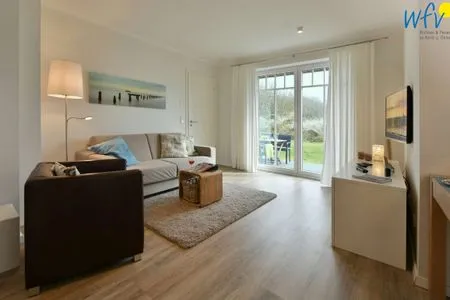 Wohnzimmer Bootshaus in den Dünen - 5 Ferienwohnung Dünengeflüster