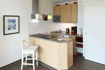 Offene Küche in der Ferienwohnung Watt'n Blick in Wittdün auf Amrum Haus Nordenlicht Ferienwohnung Watt'n Blick