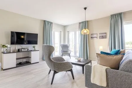 Ferienwohnung Boddenkieker Ostseebad Wustrow - ZweiWasser Alte Seefahrtschule Wohnzimmer  Boddenkieker