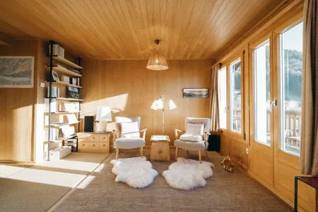 Wohnzimmer mit Sessel Chalet Engihalde