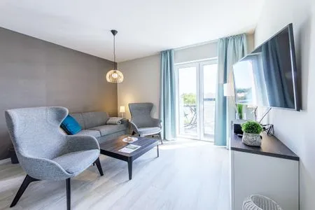 Ferienwohnung Boddenperle Ostseebad Wustrow ZweiWasser Alte Seefahrtschule Lichtdurchflutetes Wohnzimmer  Boddenperle