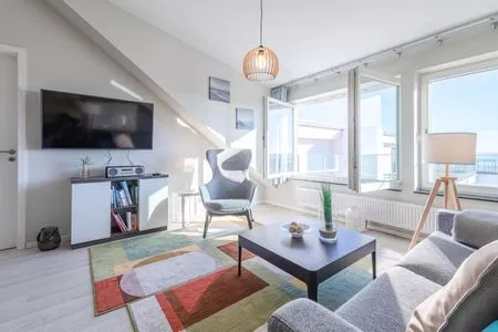 Ferienwohnung Seebadbrise Ostseebad Wustrow ZweiWasser Alte Seefahrtschule Wohnzimmer mit Wasserblick  Seebadbrise