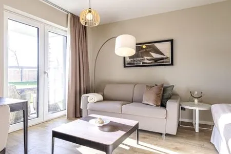 Ferienwohnung Kleiner Strandkorb Ostseebad Wustrow ZweiWasser Alte Seefahrtschule Gemütlicher Wohnbereich  Kleiner Strandkorb