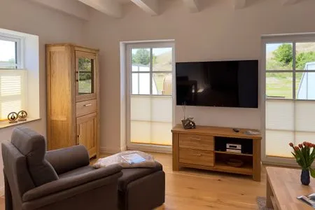 Wohnzimmer Haus Dünenperle Ferienwohnung "Dünengras"