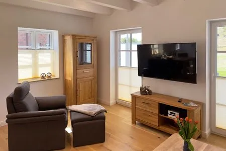 Wohnzimmer Haus Dünenperle Ferienwohnung "Dünengras"