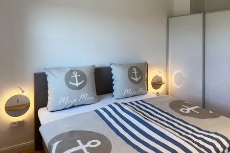 Schlafzimmer Haus Dünenperle Ferienwohnung "Dünengras"