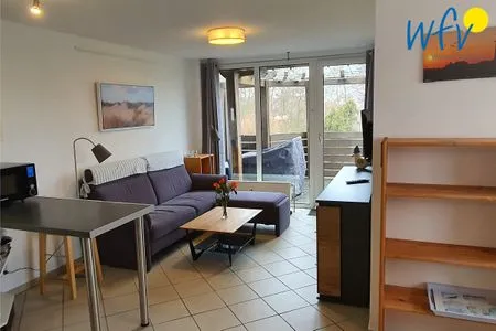 Wohnzimmer Ferienhaus Greune-Stee-Weg 103b Ferienwohnung Inselblick
