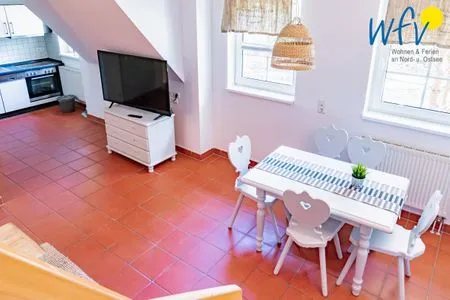 Wohnzimmer Ferienhaus am Gutspark Dranske Ferienwohnung Seegras
