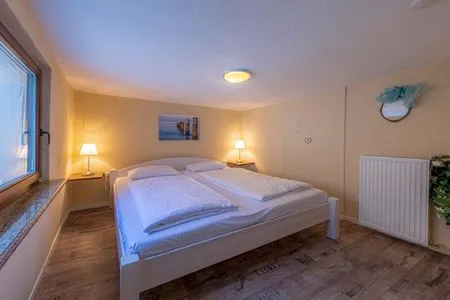 Ferienhaus InselGlück in Malchow Schlafzimmer mit Doppelbett  InselGlück