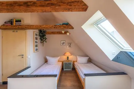 Ferienhaus InselGlück in Malchow Schlafzimmer mit zwei Einzelbetten  InselGlück
