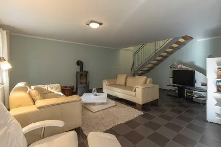 Ferienhaus Träumerei Blick ins Wohnzimmer mit Kamin  Träumerei