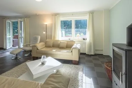 Ferienhaus Träumerei Blick auf die Couch im Wohnzimmer  Träumerei