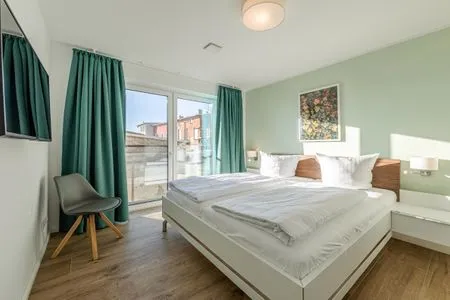Ferienwohnung Wasserlilie Malchow Blick in eines der Schlafzimmer  Wasserlilie