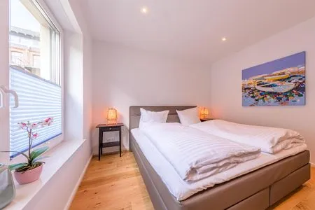 Ferienwohnung Inselzauber in Malchow eines der Schlafzimmer mit Doppelbett  Inselzauber