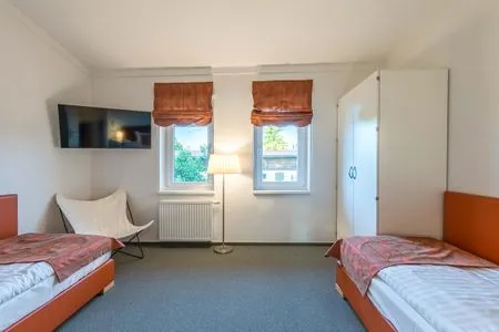 Ferienwohnung Fischadler Blick in eines der Schlafzimmer mit Einezlbetten  Fischadler
