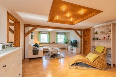 Wohnzimmer mit gemütlichen Sitzgelegenheiten Ferienwohnung Schwalbennest