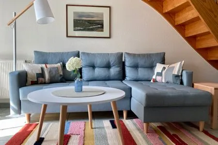 Wohnbereich mit Sofa Achtern Diek Achtern Diek 12b - Wohnung 5