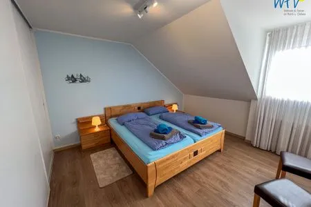 Schlafzimmer Ferienhaus Upholmstr. Ferienwohnung Düne 116