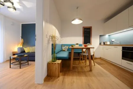 Wohnzimmer Apartment Gartenblick 7/4 EG mit überdachter Terrasse