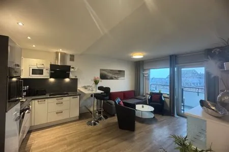 Küche offen zum Wohnbereich Ferienwohnung im Haus Nordland App 97