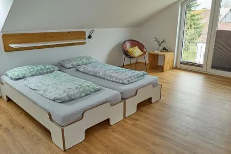 Schlafzimmer Apartment 7/8 DG mit Bergblick