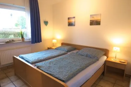 Schlafzimmer Ferienwohnung Lohr am Deich
