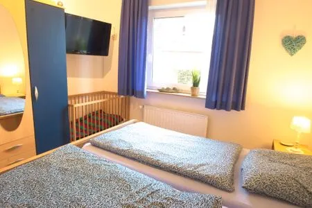Schlafzimmer Ferienwohnung Lohr am Deich
