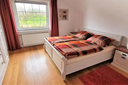 Schlafzimmer Fuhrmannshof Ferienwohnung Cassen