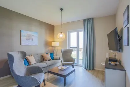 Ferienwohnung Boddenlümmel Ostseebad Wustrow - ZweiWasser Alte Seefahrtschule Wohnzimmer  Boddenlümmel