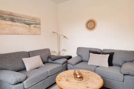 Wohnzimmer Ferienwohnung "Achtern Diek 1" 1. Reihe an der Ostseeküste