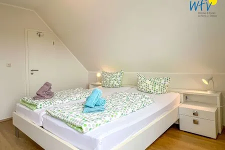 Schlafzimmer Apartmenthaus Roberta Ferienwohnung Leuchtturm
