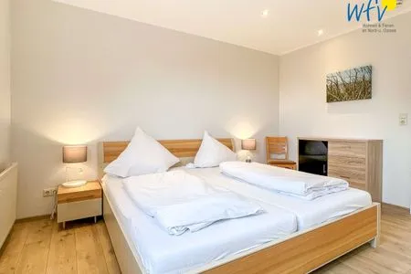 Schlafzimmer Apartmenthaus Roberta Ferienwohnung Borkum Riff