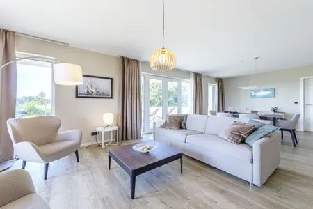 Ferienwohnung Strandidylle Ostseebad Wustrow Wohnzimmer mit gemütlichem Sofa  Strandidylle