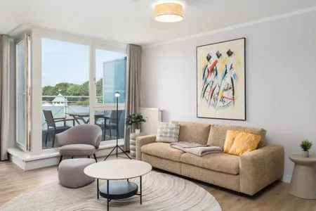 Ferienwohnung Windflüchter Aparthotel Zingst - Wohnzimmer mit Balkon Zugang  Windflüchter